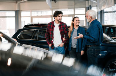 car-dealer-showing-cars-couple-260nw-2431820587