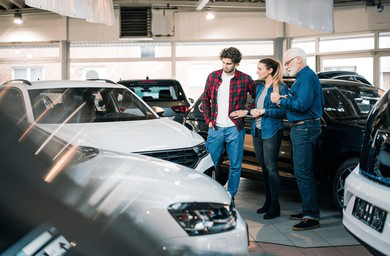car-dealer-showing-cars-couple-260nw-2431820593